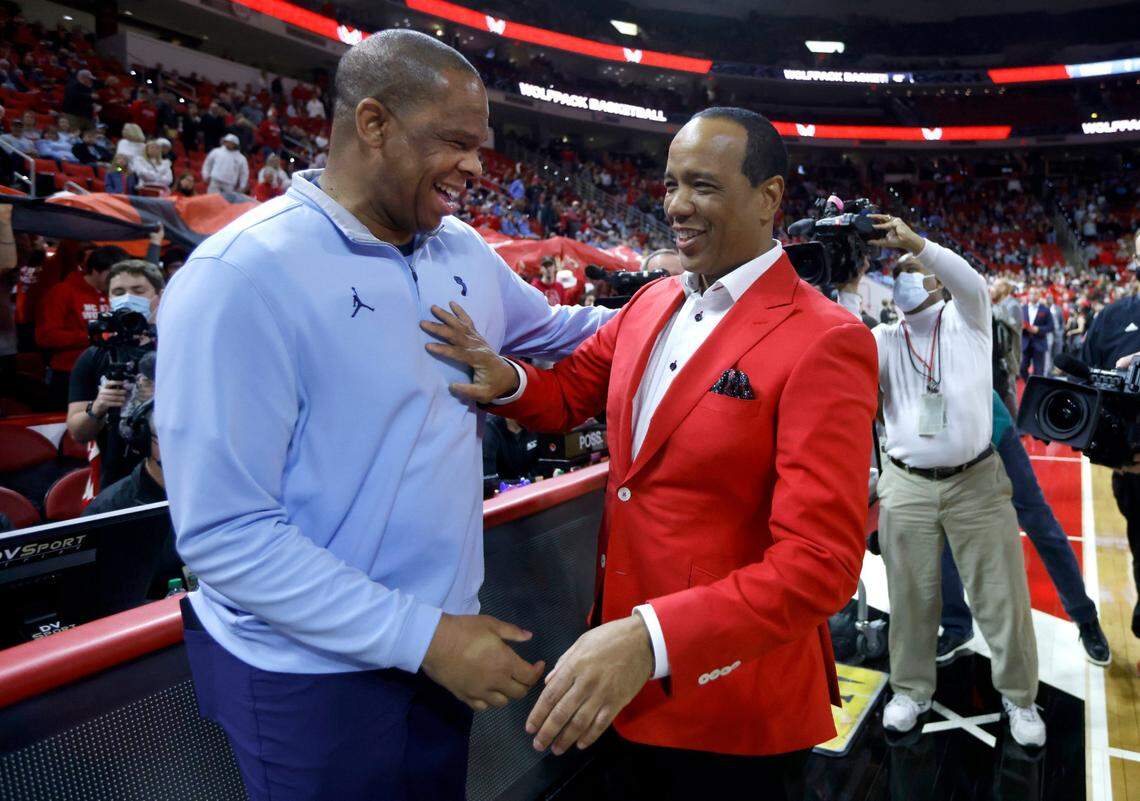 North Carolina head coach Hubert Davis talks with N.C. State head coach Kevin Keatts before N.C. States game against UNC at PNC Arena in Raleigh, N.C., Saturday, Feb. 26, 2022.