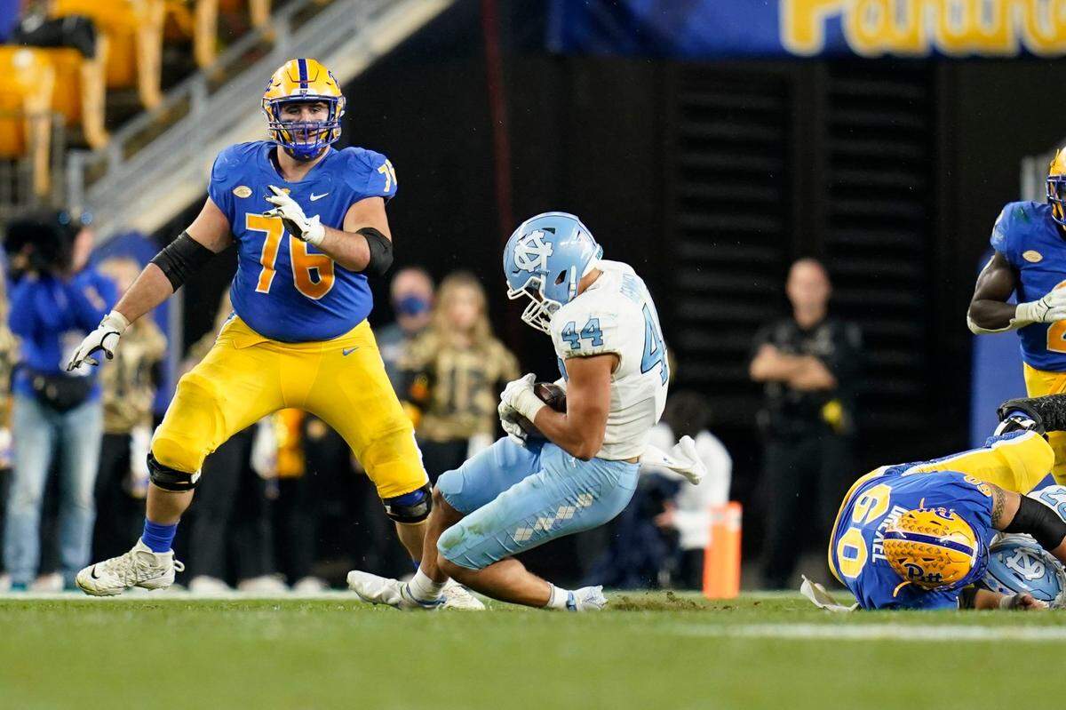North Carolina linebacker Jeremiah Gemmel (44) intercepts a pass by Pittsburgh quarterback Kenny Pickett with under a minute left in regulation in an NCAA college football game, Thursday, Nov. 11, 2021, in Pittsburgh. Pittsburgh won 30-23 in overtime. (AP Photo/Keith Srakocic)
