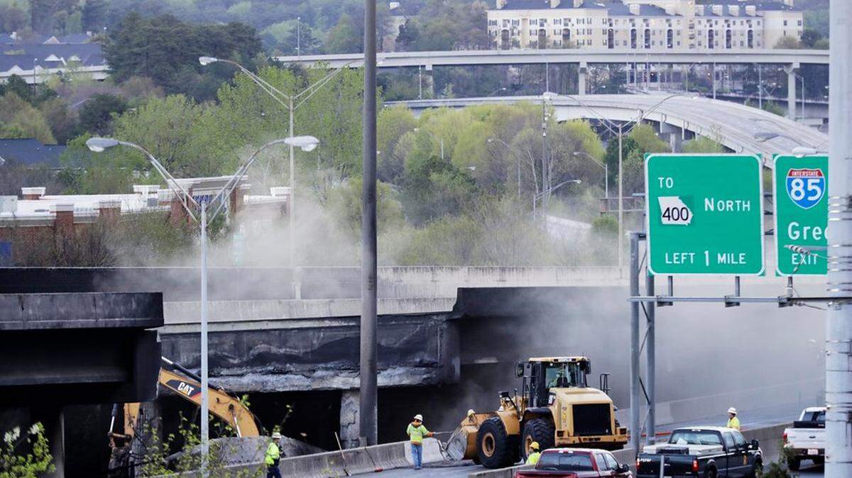 Crews work on an overpass that collapsed from a large fire on Interstate 85 in Atlanta, March 31, 2017.