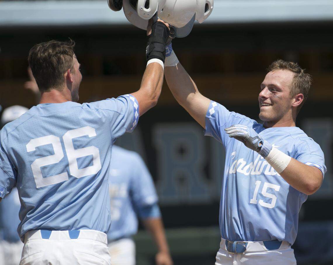 North Carolina’s Michael Busch (15) celebrates with Jackson Hesterlee (26) after a three run homer in the fourth inning against North Carolina A&T during the NCAA Regional on Friday, June 1, 2018 at Boshamer Stadium in Chapel HIill, N.C. The Tar Heels scored five runs in the fifth to open a 7-0 lead over North Carolina A&T.