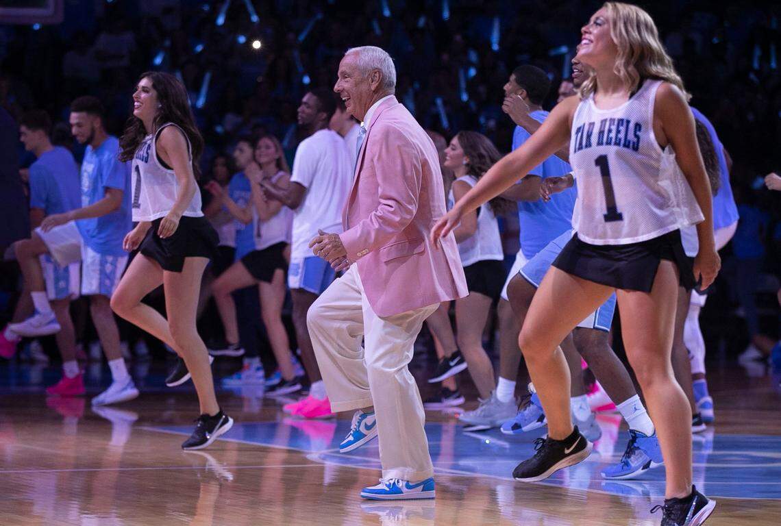 North Carolina coach Roy Williams shakes a leg with the UNC Dance Team during the annual Late Night With Roy Williams kickoff to the basketball season on Friday, September 27, 2019 at the Smith Center in Chapel Hill, N.C.
