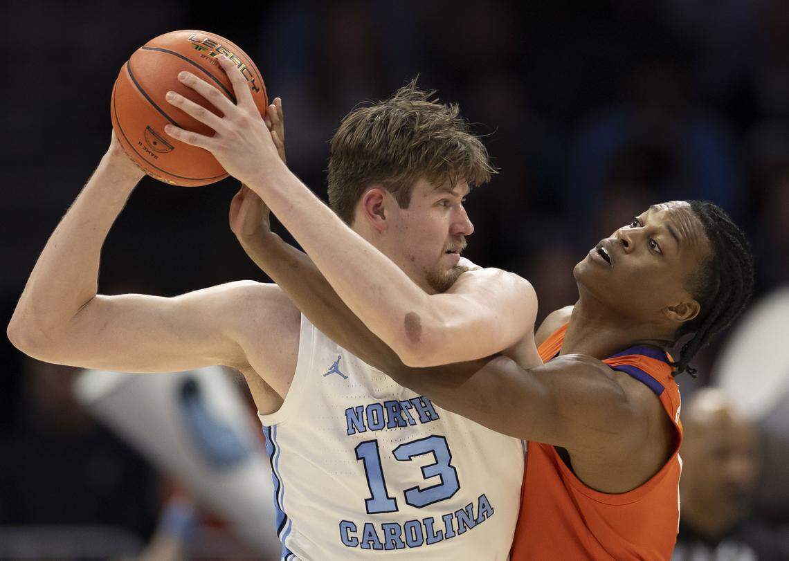 Clemson forward R J Godfrey (0) defends North Carolina center Henri Veesaar (13) in the first half on Thursday, March 12, 2026, during the quarterfinals of the ACC Tournament at Spectrum Center in Charlotte, N.C.