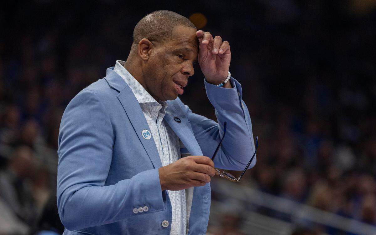 Down by ten points, North Carolina coach Hubert Davis wipes his brow during the second half against Kentucky on Saturday, December 16, 2023 at State Farm Arena in Atlanta, Georgia.