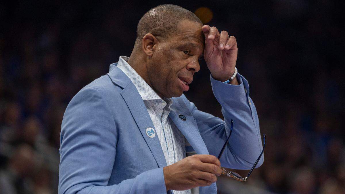 Down by ten points, North Carolina coach Hubert Davis wipes his brow during the second half against Kentucky on Saturday, December 16, 2023 at State Farm Arena in Atlanta, Georgia.