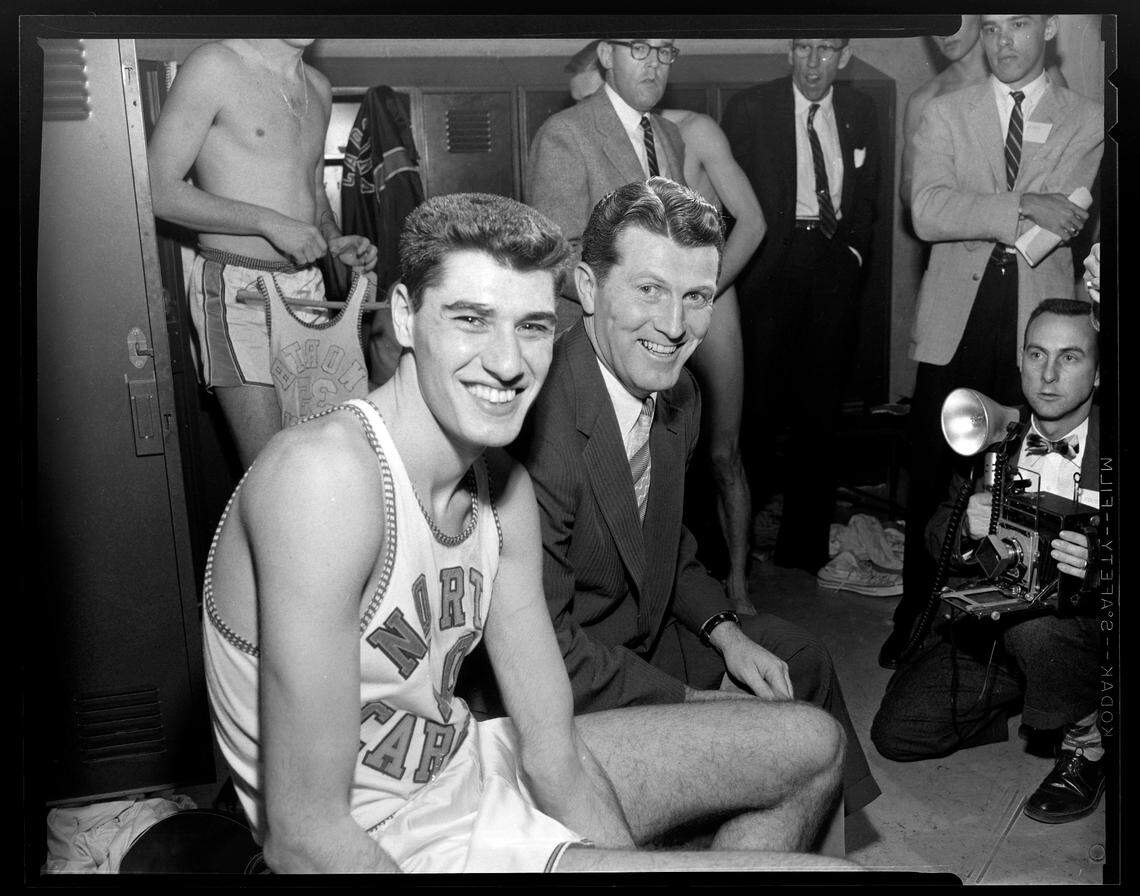 UNC’s Lennie Rosenbluth poses with coach Frank McGuire in the UNC locker room at the 1957 ACC Tournament.