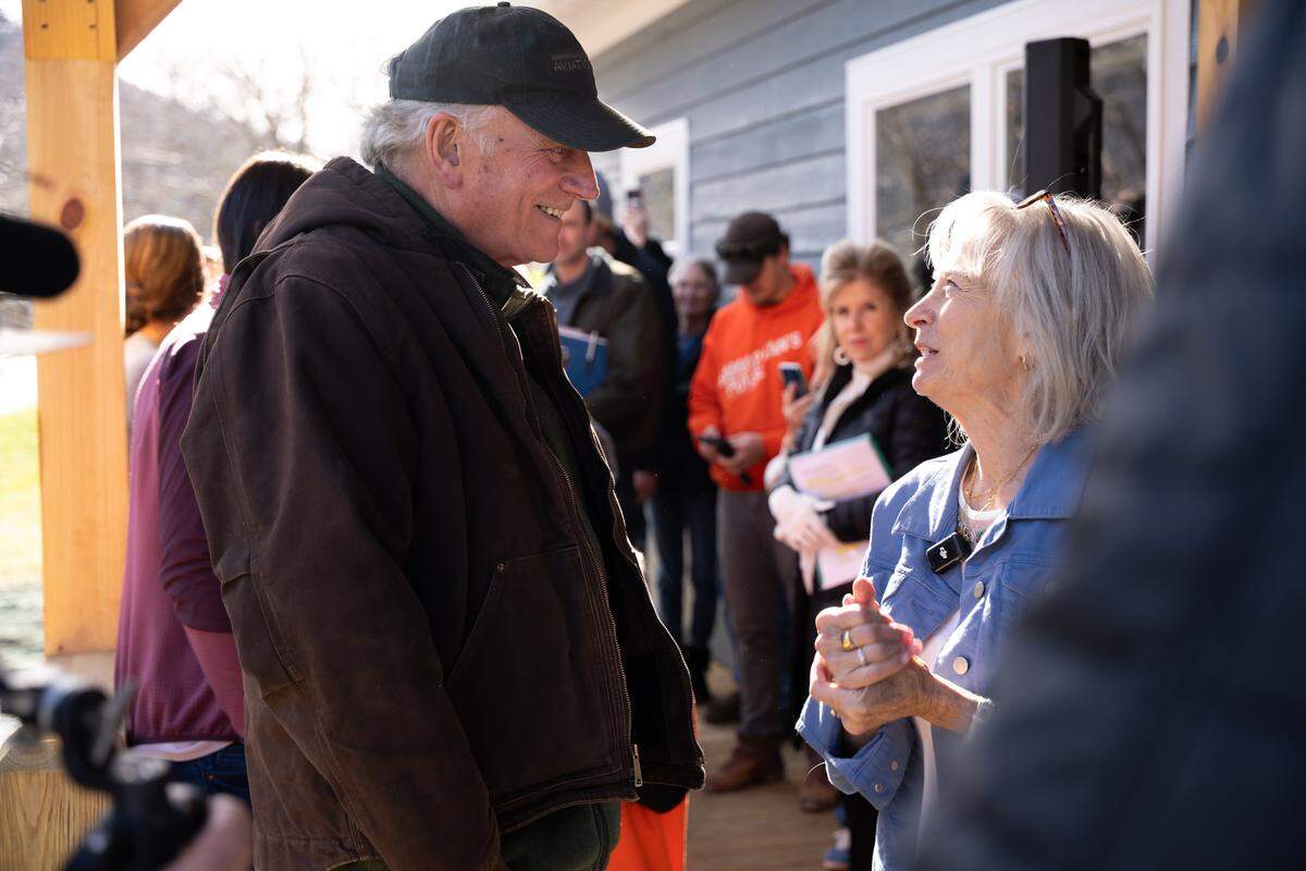 Franklin Graham, CEO of Samaritan’s Purse, celebrates with Edwina Tatum, who lost her family’s house to Hurricane Helene. The Boone-based charity rebuilt it in roughly four months.