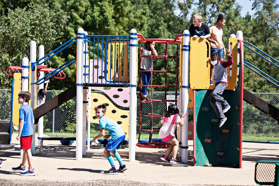Students are given the option of taking their masks off during outdoor recess at Carpenter Elementary School in Cary on Thursday morning, Aug. 19, 2021. North Carolina students will start their third school year dealing with the coronavirus pandemic just as the highly contagious delta variant is rapidly spreading across the state.