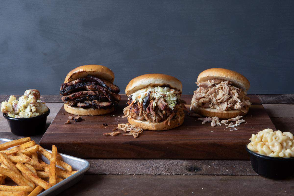 Red Hot & Blue serves a variety of barbecue sandwiches made with meats including pulled pork or chicken, sliced brisked and smoked sausage.