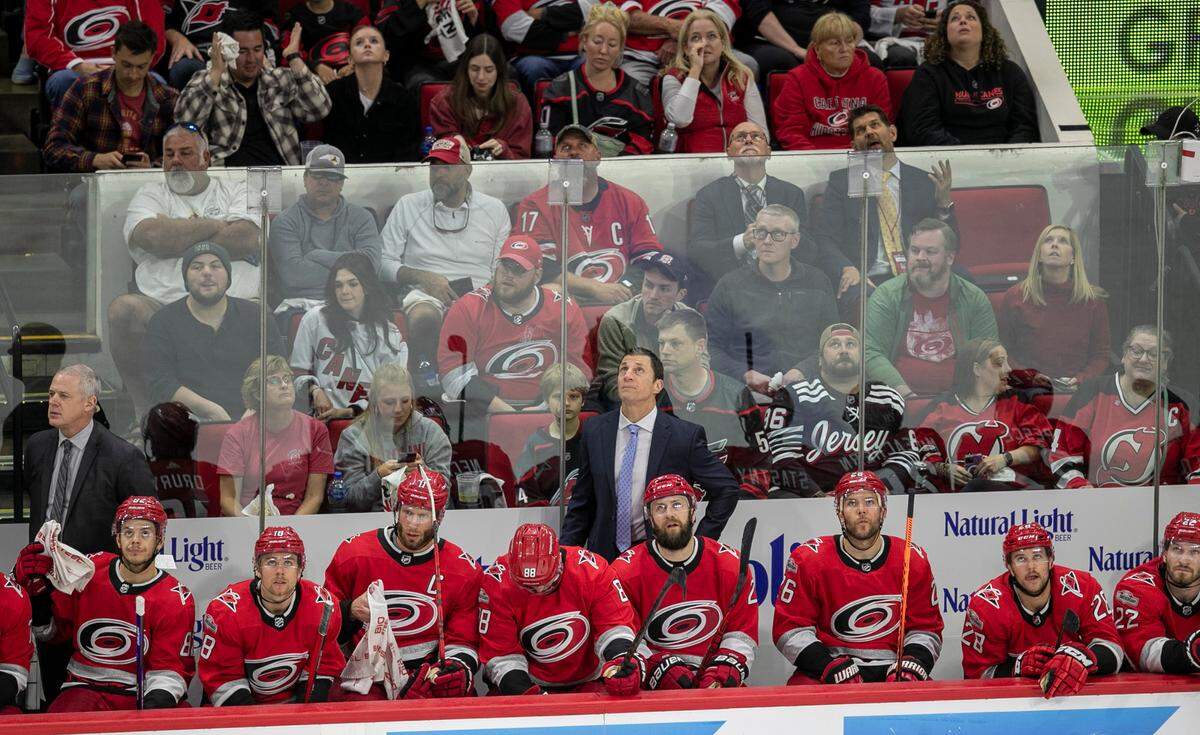 Carolina Hurricanes coach Rod Brind’Amour checks the scoreboard during the third period against the New Jersey Devils during Game 5 of their second round Stanley Cup playoff series on Thursday, May 11, 2023 at PNC Arena in Raleigh, N.C.