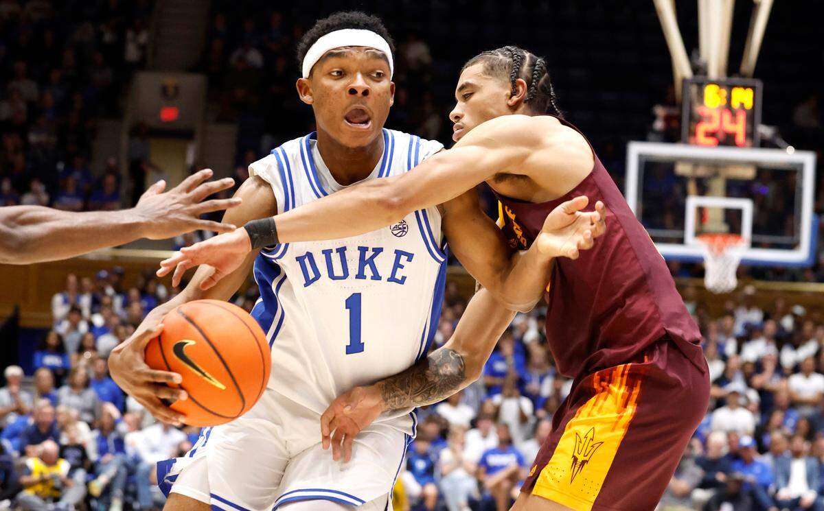Duke’s Caleb Foster (1) drives by Arizona State’s Austin Nunez (2) during the first half of Duke’s game against Arizona State in the Brotherhood Run Charity Game at Cameron Indoor Stadium in Durham, N.C., Sunday, Oct. 27, 2024.