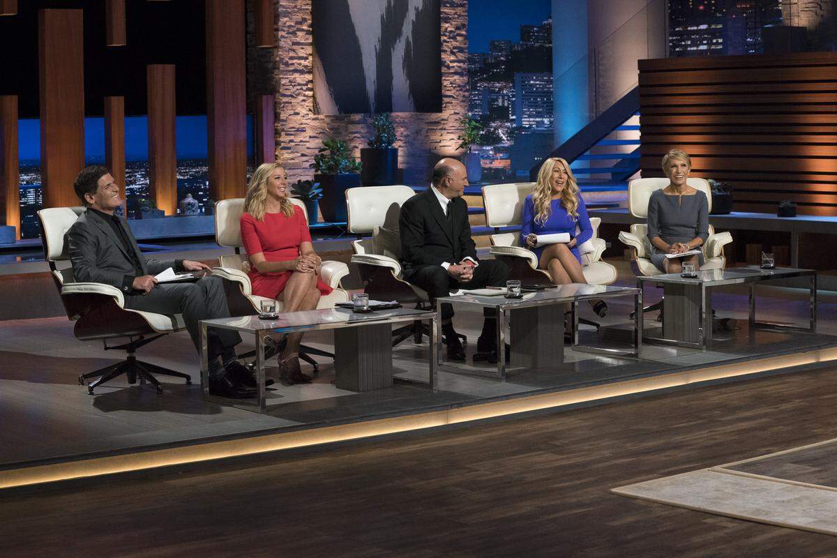 “Shark Tank” judges (L-R) Mark Cuban, Sara Blakely, Kevin O’Leary, Lori Greiner and Barbara Cochran listen as Raleigh entrepreneur Jon Hayes pitches RewardStock.