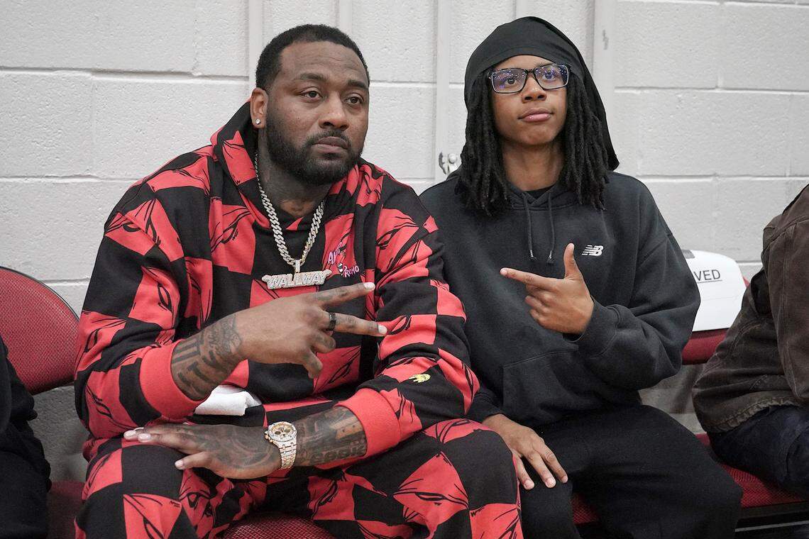NBA All-Star and the tournament namesake, John Wall, poses with a fan during halftime of the Day'Ron Sharpe Bracket finals. The Greenfield Knights and the Coronado Cougars (Nevada) met in the finals of the Day'Ron Sharpe bracket of the  John Wall Holiday Tournament in Raleigh, N.C. on December 30, 2025.