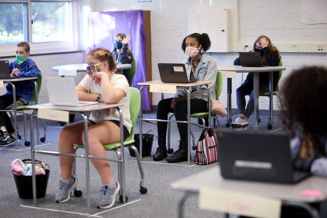 Carroll Middle School sixth-graders attend their ELA class on the first day of in-person school for some students on Monday, Nov. 9, 2020.