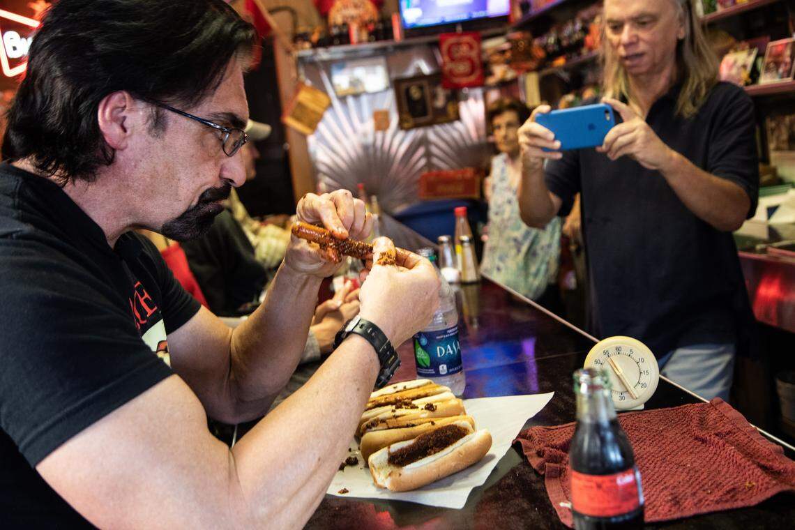 Gregory Scott Wilson forced down 27 fully loaded chili dogs in 51 minutes Wednesday, breaking the record at The Roast Grill in Raleigh.