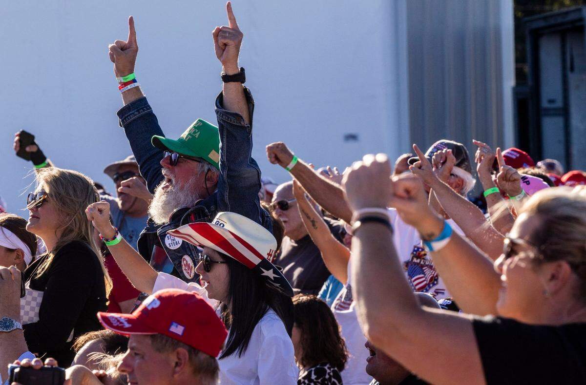 Supporters cheer as Lt. Gov. Mark Robinson speaks during a rally featuring former president Donald Trump at Wilmington International Airport Friday, Sept. 23, 2023.
