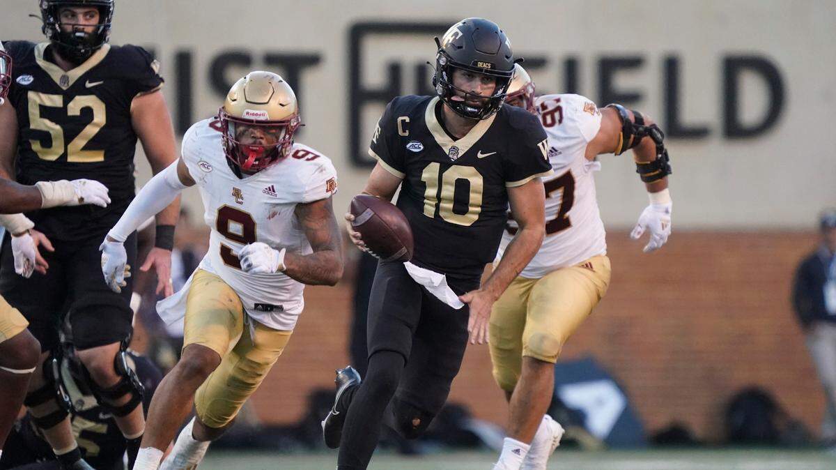 Wake Forest quarterback Sam Hartman (10) runs for a long gain against Boston College during the second half of an NCAA college football game in Winston-Salem, N.C., Saturday, Oct. 22, 2022. (AP Photo/Chuck Burton)