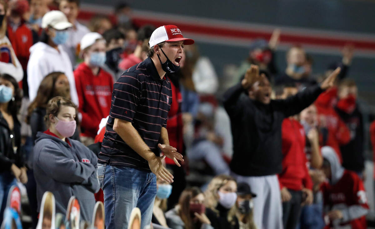 N.C. State fans are not happy with the official’s call during the first half of N.C. State’s game against Miami at Carter-Finley Stadium in Raleigh, N.C., Friday, Nov. 6, 2020.