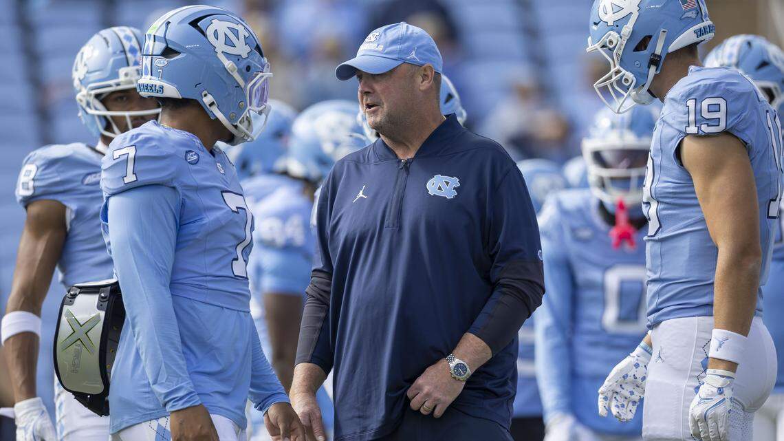 North Carolina offensive coordinator Freddie Kitchens talked with quarterback Gio Lopez (7) prior to the Tar Heels’ game against Virginia on Saturday, October 25, 2025, at Kenan Stadium in Chapel Hill, N.C. Kitchens is out after North Carolina had one of the worst offensive performances in the FBS while going 4-8 this season.
