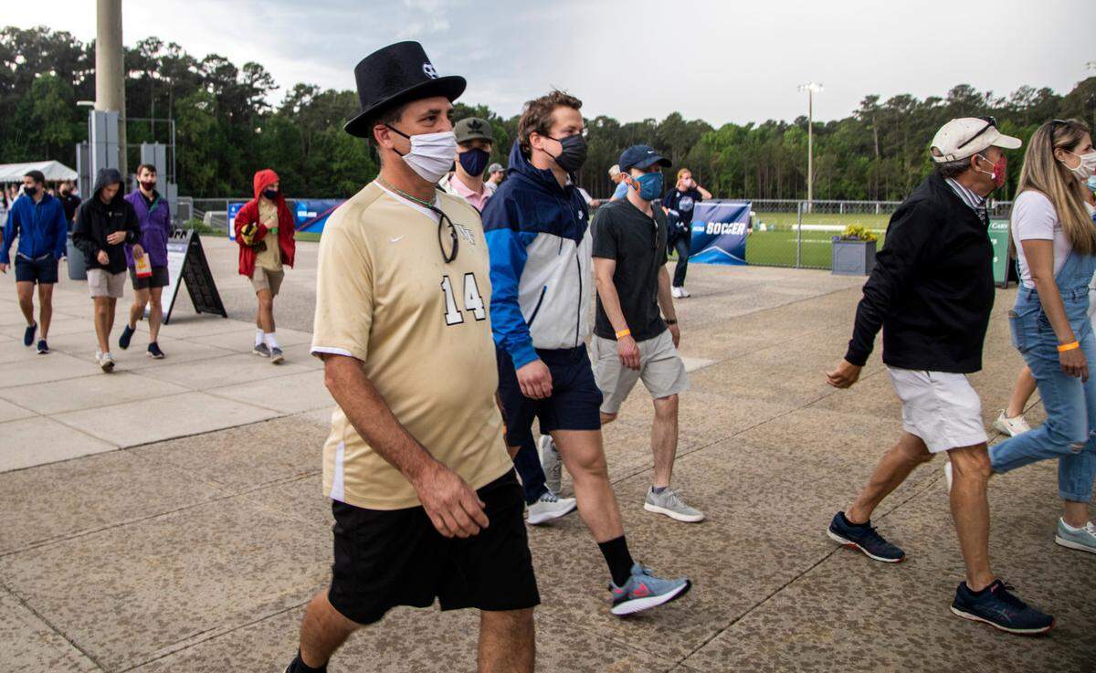 Fans attending the Wake Forest UNC-Chapel Hill’s game head to their cars durning a lightning delay during the Division I Men’s Soccer Championship quarterfinals at WakeMed Soccer Park in Cary Monday, May 10, 2021.