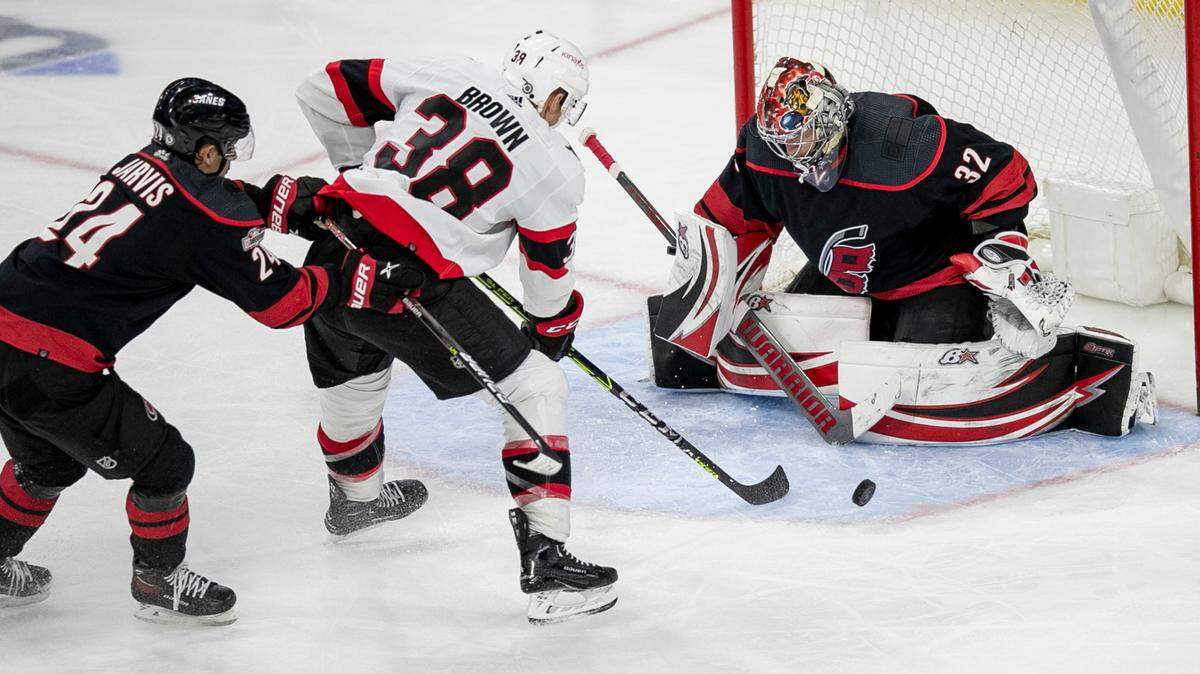 Carolina Hurricanes’ goalie Antii Raanta (32) stops a scoring attempt by Ottawa’s Patrick Brown (38) during the third period on Tuesday, April 4, 2023 at PNC Arena in Raleigh, N.C. Raanta had 26 saves in the Hurricanes’ 3-2 victory.