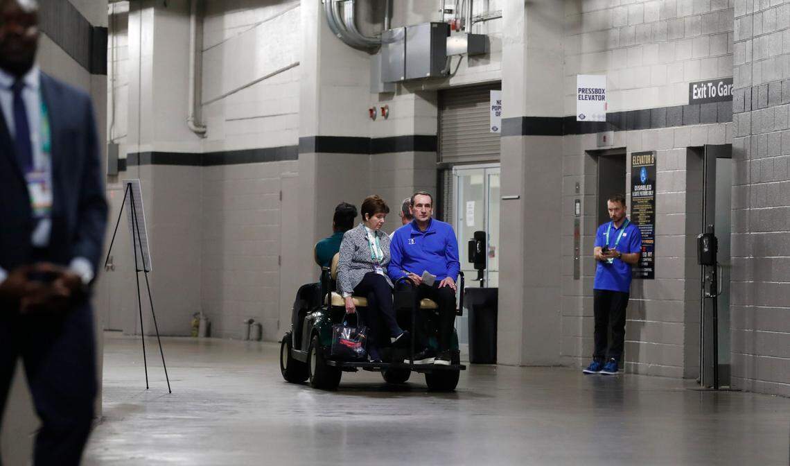 Duke head coach Mike Krzyzewski and wife Micke head back to the locker room after the post game press conference after North Carolina’s 81-77 victory over Duke in the Final Four at Caesars Superdome in New Orleans, La., Saturday, April 2, 2022.