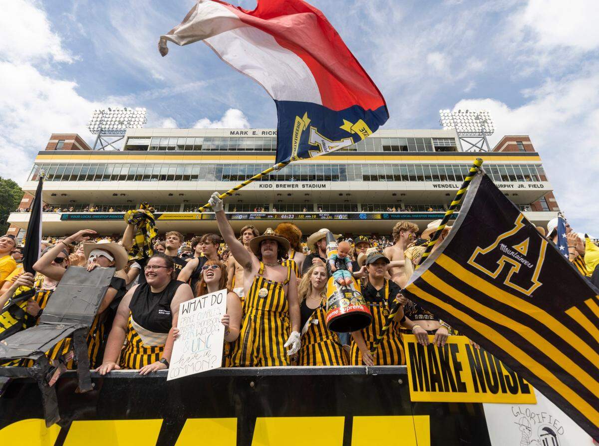 The Appalachian State student section shows their support as their team enters the field to warm up before their game against North Carolina on Saturday, September 3, 2022 at Kidd Brewer Stadium in Boone, N.C