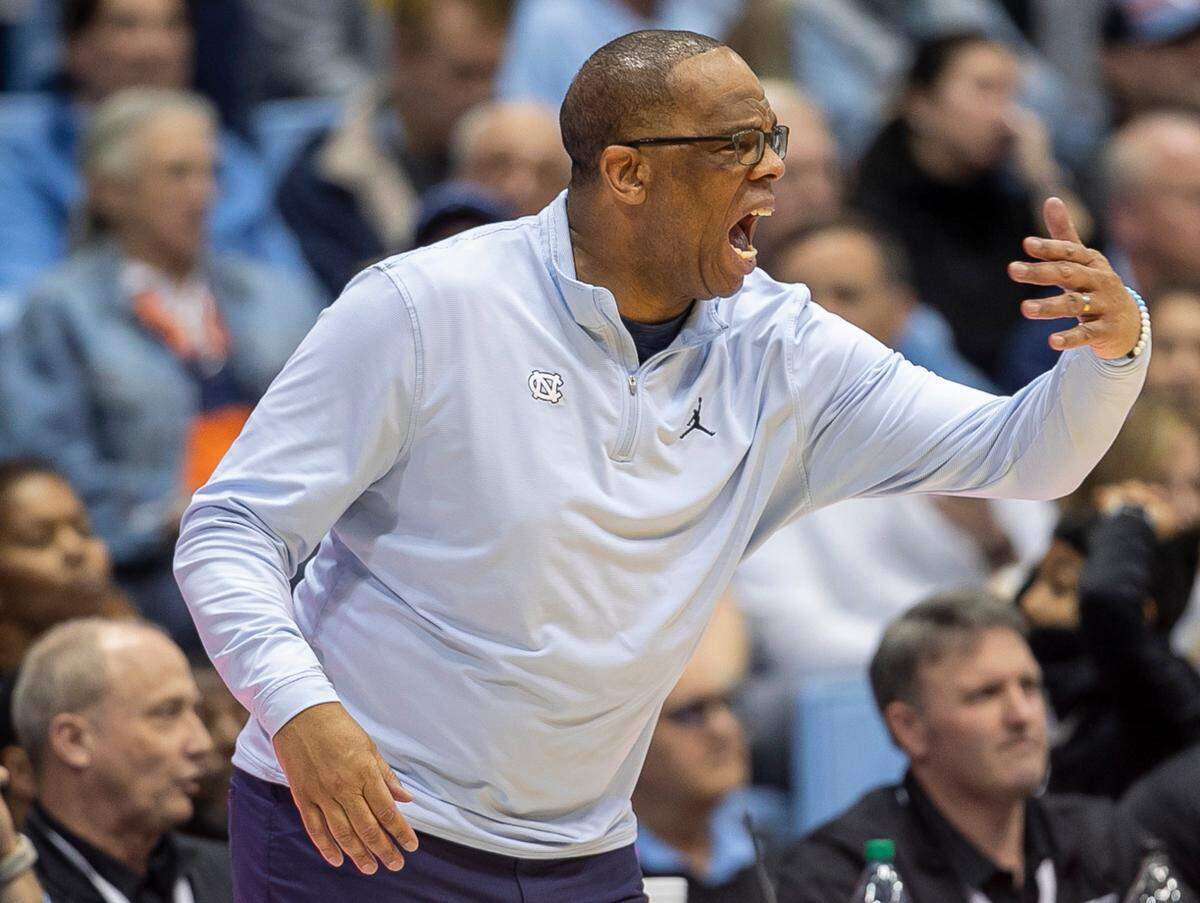 North Carolina coach Hubert Davis directs his team in the second half against Virginia on Saturday, February 25, 2023 at the Smith Center in Chapel Hill, N.C.