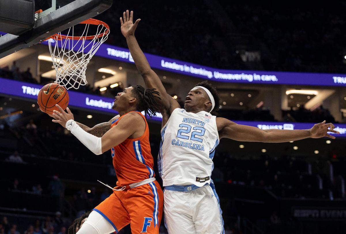 Florida’s Denzel Aberdeen (11) breaks to the basket ahead of North Carolina forward Ven-Allen Lubin (22) in the second half during the Jumpman Invitational on Tuesday, December 17, 2024 at the Spectrum Center in Charlotte, N.C.