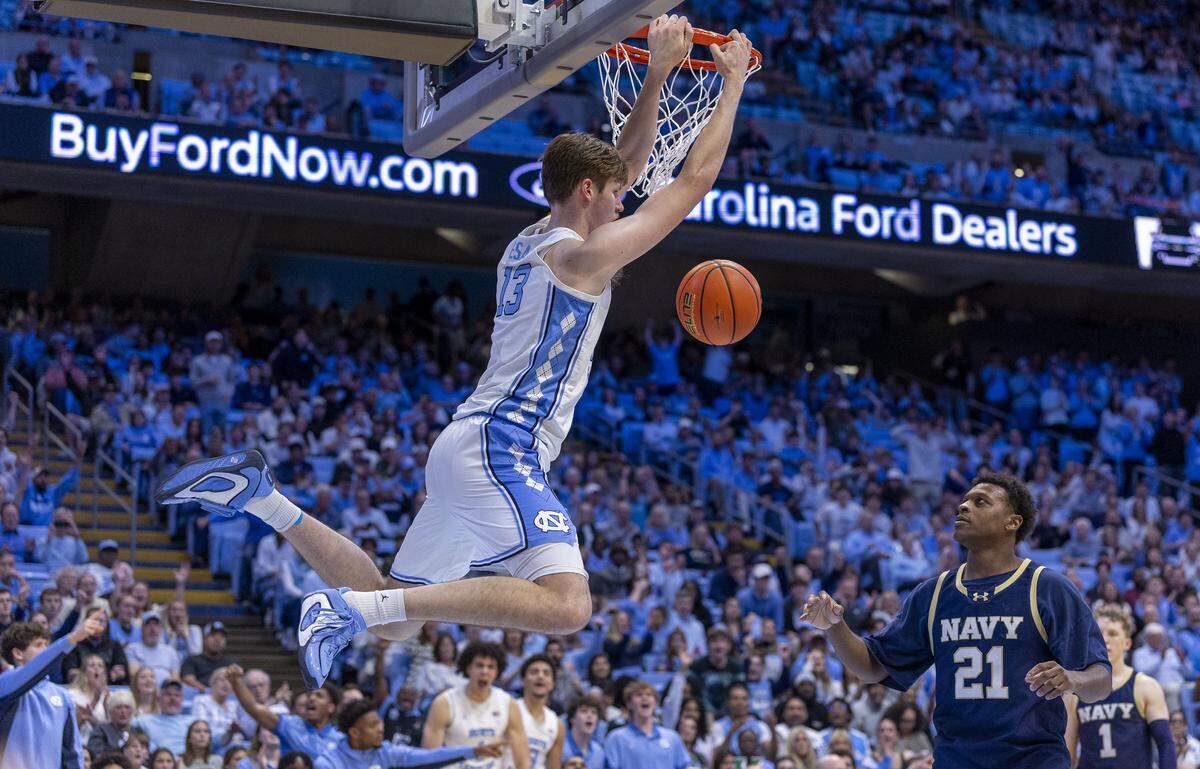 North Carolina center Henri Veesaar (13) dunks against Navy guard Jordan Pennick (21) in the second half on Tuesday, November 18, 2025 at the Smith Center in Chapel Hill, N.C.