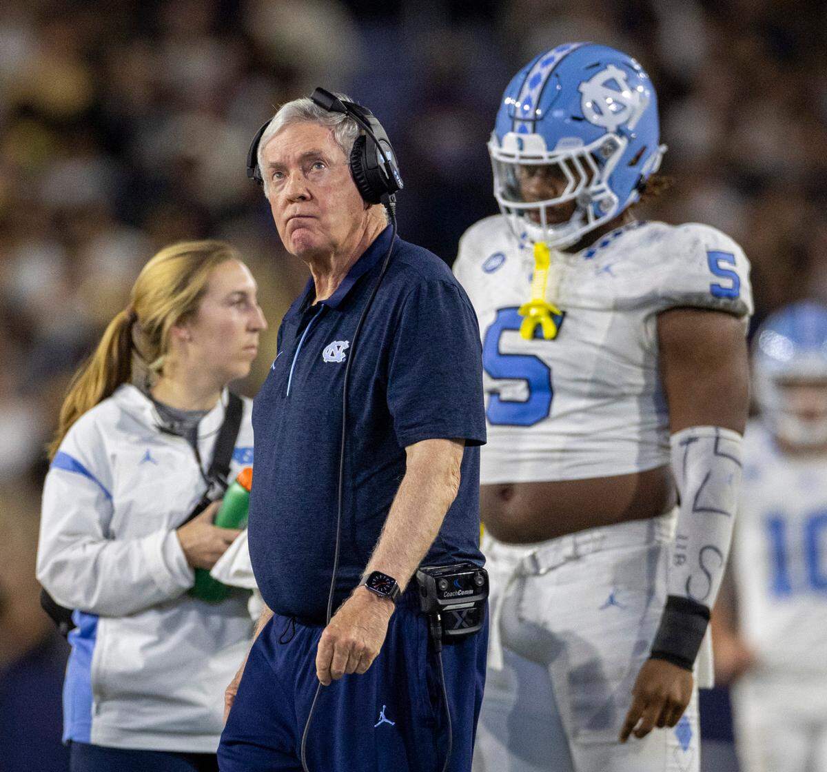 North Carolina coach Mack Brown checks the video replay as he walks to check on Devontez Walker (9) who was injured by Georgia Tech’s Kyle Efford (44) and Ahmari Harvey (18) in the fourth quarter on Saturday, October 28, 2023 at Bobby Dodd Stadium in Atlanta, Georgia.