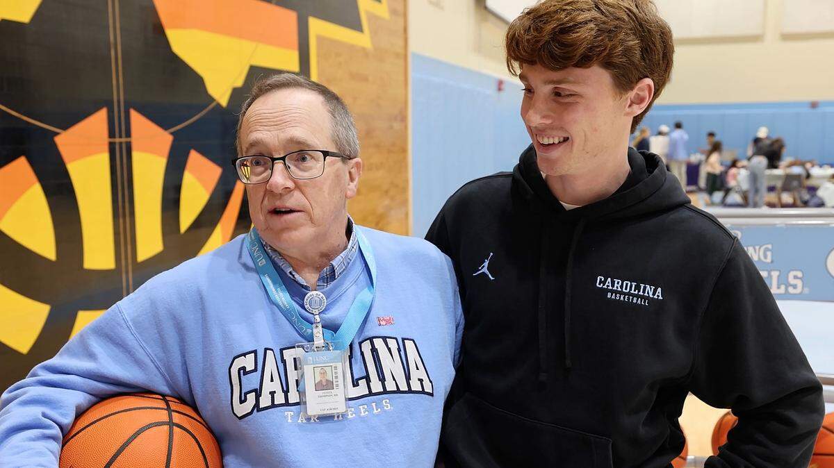 Dr. Patrick Thompson of North Carolina Children’s Hospital and North Carolina men’s basketball team manager James Blizzard pause to chat during their pick-up game at the Shoes 4 Hope event in Chapel Hill.