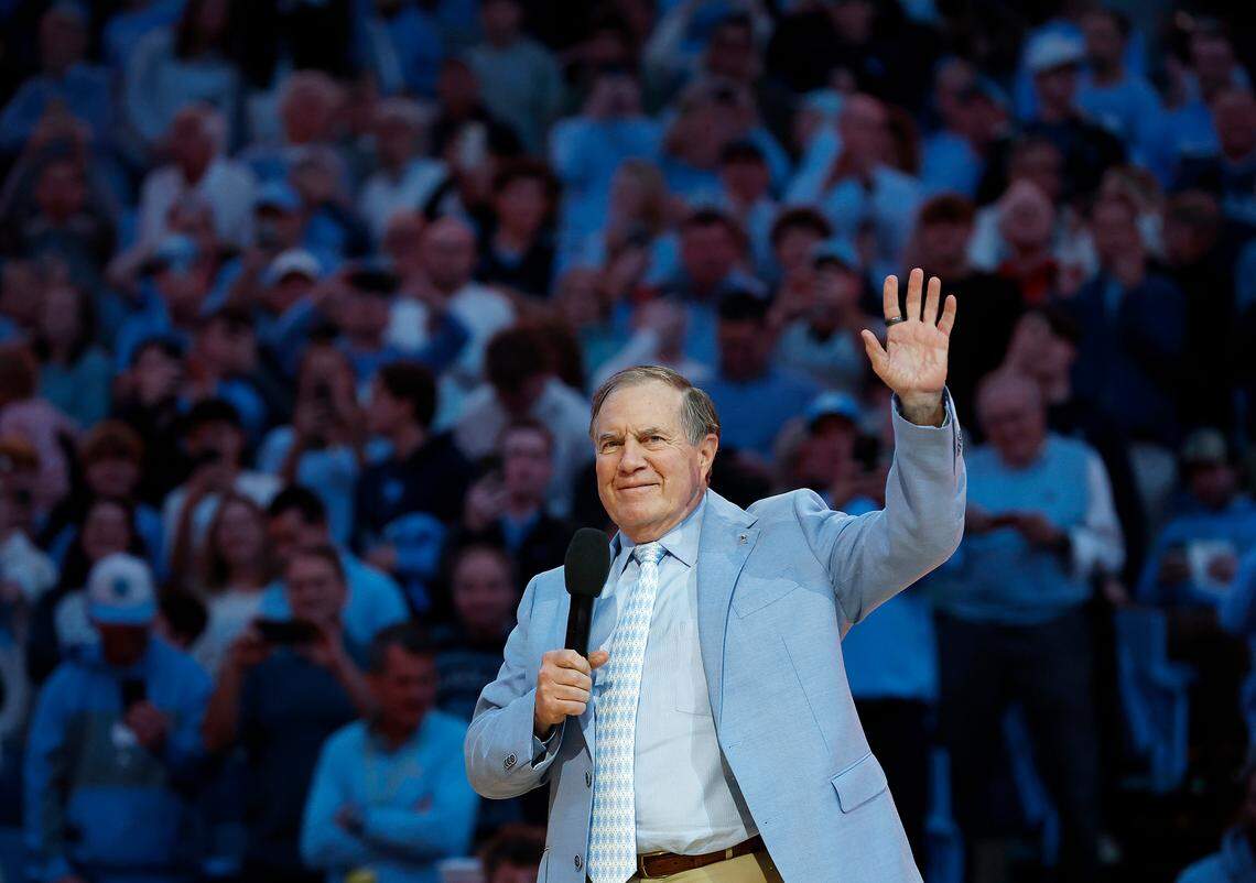 Recently hired North Carolina football coach Bill Belichick acknowledges the crowd as he is introduced during halftime of the Tar Heels’ men’s basketball game against La Salle on Saturday, Dec. 14, 2024, at the Smith Center in Chapel Hill, N.C.