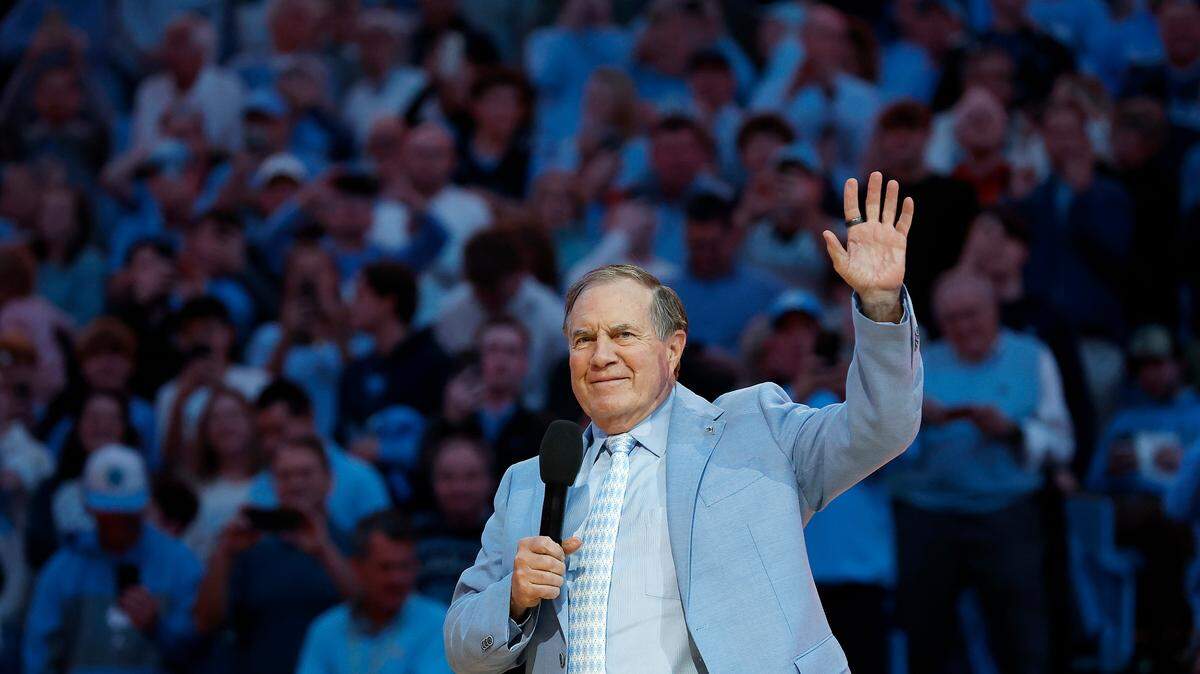 Recently hired North Carolina football coach Bill Belichick acknowledges the crowd as he is introduced during halftime of the Tar Heels’ men’s basketball game against La Salle on Saturday, Dec. 14, 2024, at the Smith Center in Chapel Hill, N.C.