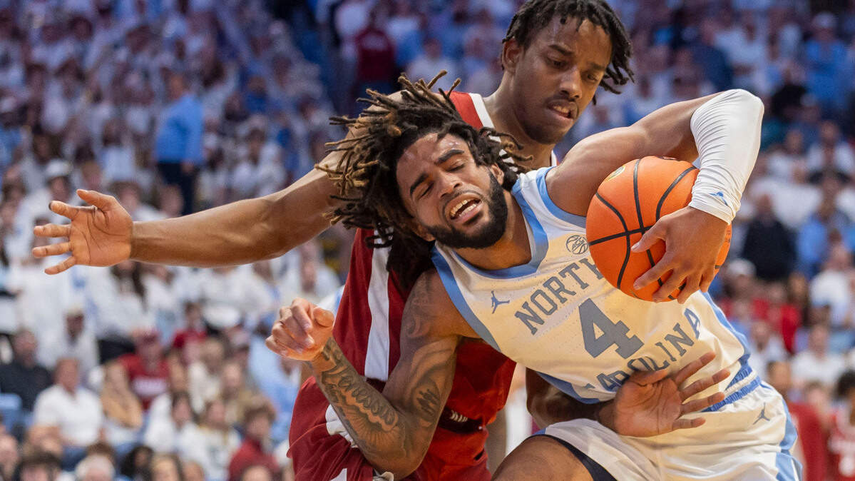 Alabama forward Derrion Reid (35) slows North Carolina guard R.J. Davis (4) with defense in the second half on Wednesday, December 4, 2024 at the Smith Center in Chapel Hill, N.C.