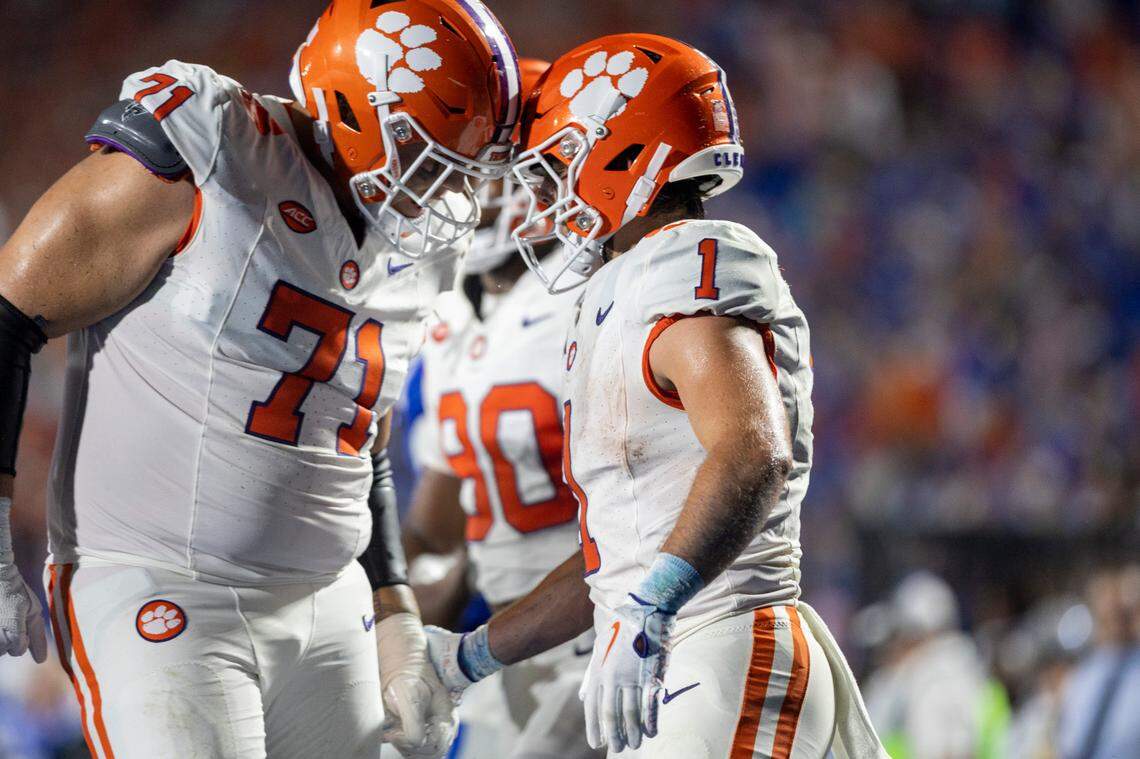 Clemson’s Tristan Leigh (71) congratulates Will Shipley (1) after scoring on a two-yard pass completion in the second quarter against Duke on Monday, September 4, 2023 at Wallace Wade Stadium Stadium in Durham, N.C.