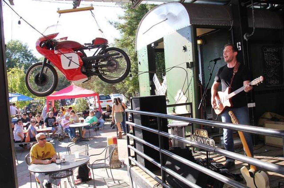 The Coal Men play the Station. Thousands filled the streets for the annual Carrboro Music Festival in September 2013. The event featured 180 acts at 25 venues.