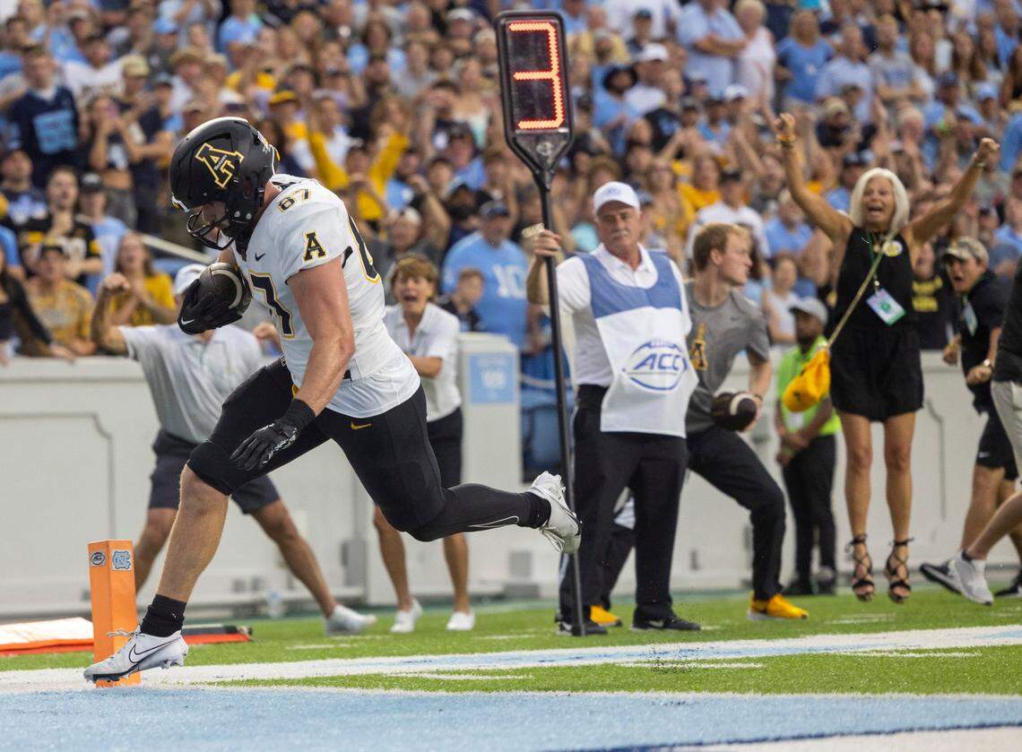 Appalachian State’s Eli Wilson (87) scores on a 5-yard pass from quarterback Joey Aguilar in the second quarter on Saturday September 9, 2023 at Kenan Stadium in Chapel Hill, N.C.