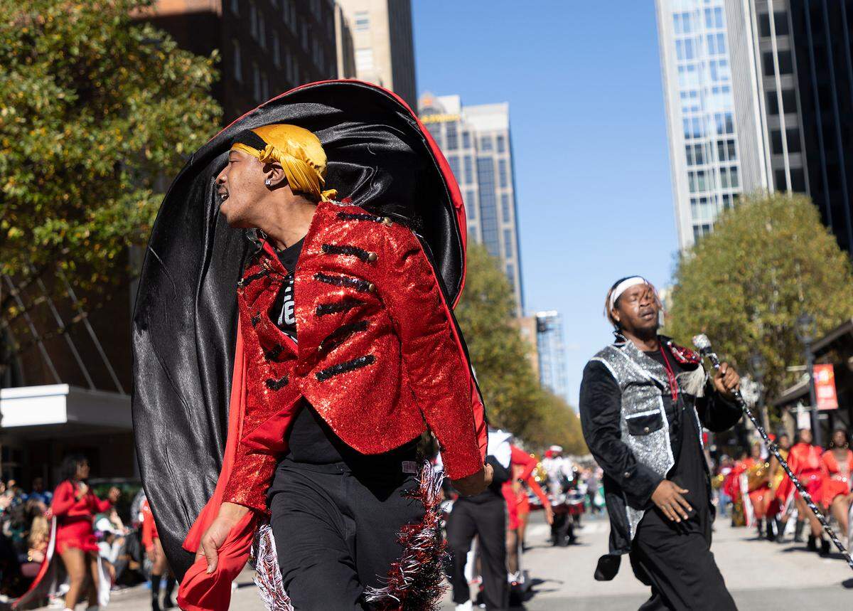 The Helping Hand Mission Marching Band performs on Fayetteville Street during the Raleigh Christmas Parade on Saturday, Nov. 18, 2023.