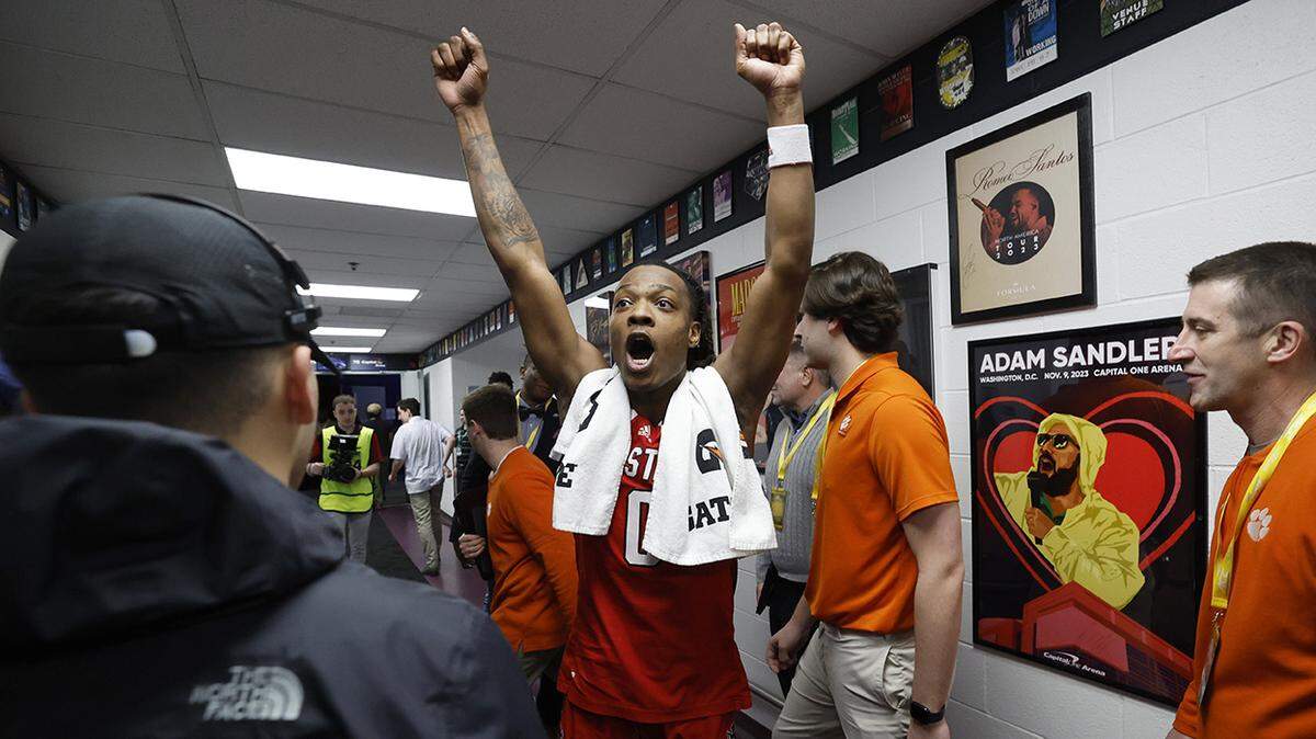 N.C. State’s DJ Horne (0) reacts as he sees the Wolfpack’s sticker on a board showing they advanced after N.C. State’s 83-65 victory over Syracuse in the second round of the 2024 ACC Men’s Basketball Tournament at Capital One Arena in Washington, D.C., Wednesday, March 13, 2024.