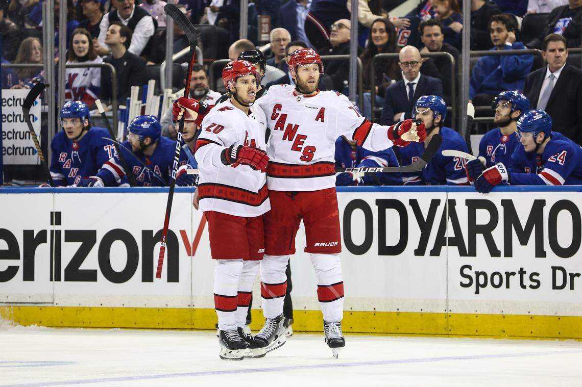 Carolina Hurricanes defenseman Jaccob Slavin (74) celebrates with center Sebastian Aho (20) after scoring a goal in the first period against the New York Rangers in game one of the second round of the 2024 Stanley Cup Playoffs at Madison Square Garden.