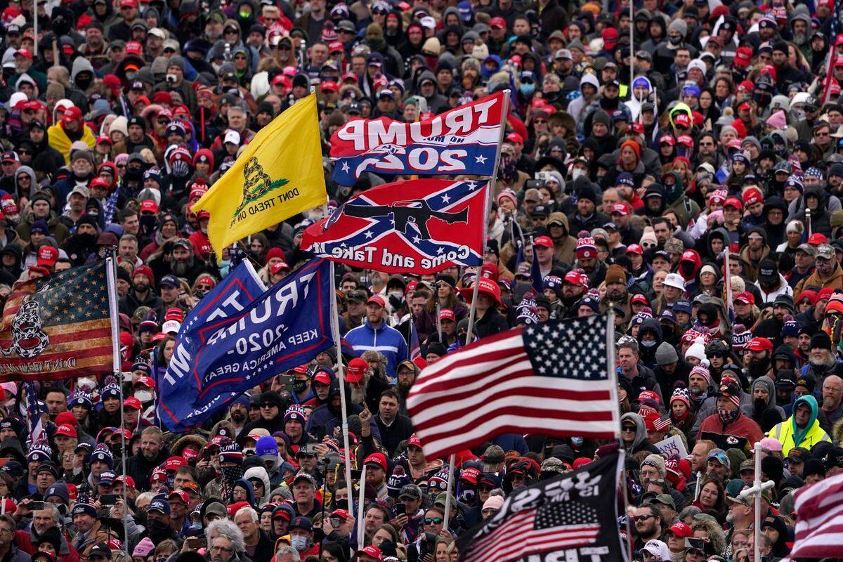 FILE - In this Jan. 6, 2021, file photo people listen as President Donald Trump speaks during a rally in Washington. Historians say Trump’s legacy and his electoral undoing will be largely shaped by rhetoric aimed at stirring his largely white base that tugged at the long-frayed strands of race relations in America. (AP Photo/Evan Vucci, File)