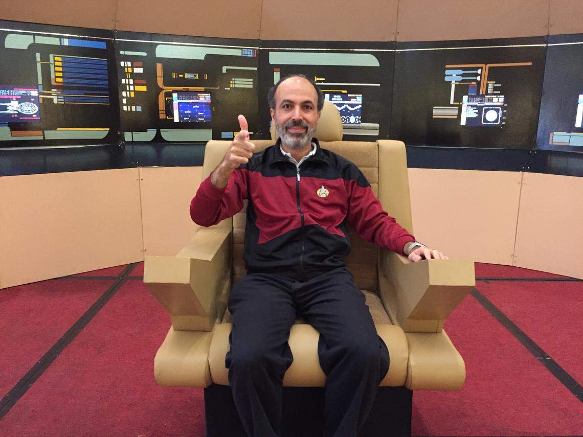 Mohamed Noor sits in the captain’s chair at the Starbase Indy “Star Trek” convention in Indianapolis, Ind., in November 2017. Noor, a biology professor at Duke University, recently authored the book “Live Long And Evolve.”