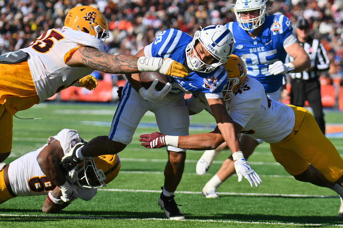Arizona State defensive lineman Justin Wodtly (95), linebacker Jordan Crook (8), and linebacker Krew Jackson (43) tackle running back Nate Sheppard of the Duke Blue Devils during the first half of the Tony The Tiger Sun Bowl game at Sun Bowl Stadium on Dec. 31, 2025 in El Paso, Texas.
