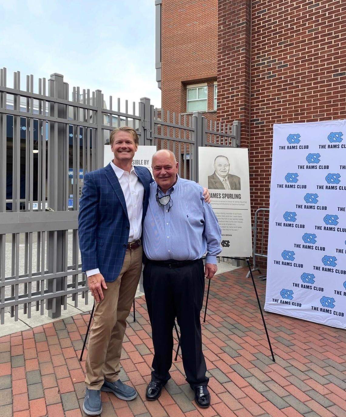 Dr. Shawn Hocker, a former North Carolina Tar Heels football player, poses with James Spurling at the Kenan Stadium concourse dedication.
