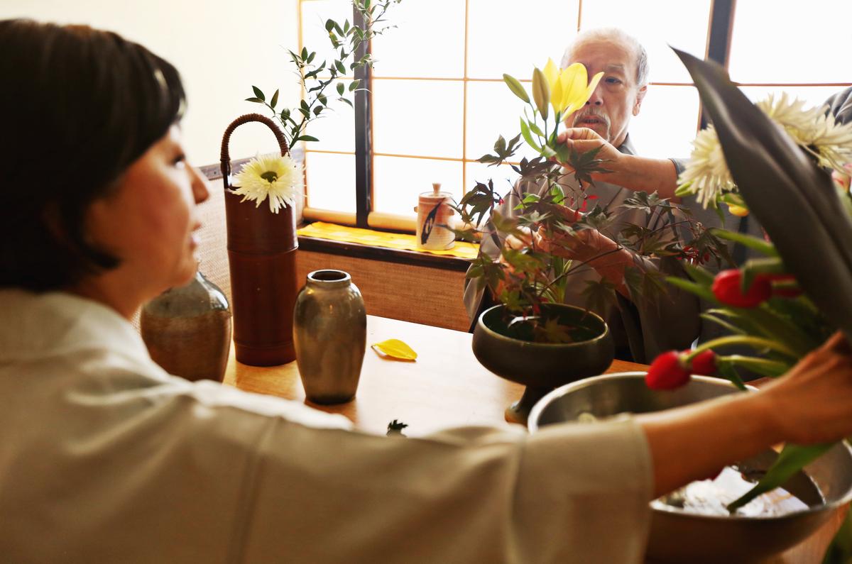 George, right, and Mayumi Yamazawa work on ikebana, the Japanese art of flower arranging, with their teacher at their Durham restaurant June 26, 2017. The couple run Yamazushi, the oldest Japanese restaurant in Durham, which went from a conventional sushi restaurant to an eight-course kaiseki, the height of Japanese cuisine.
