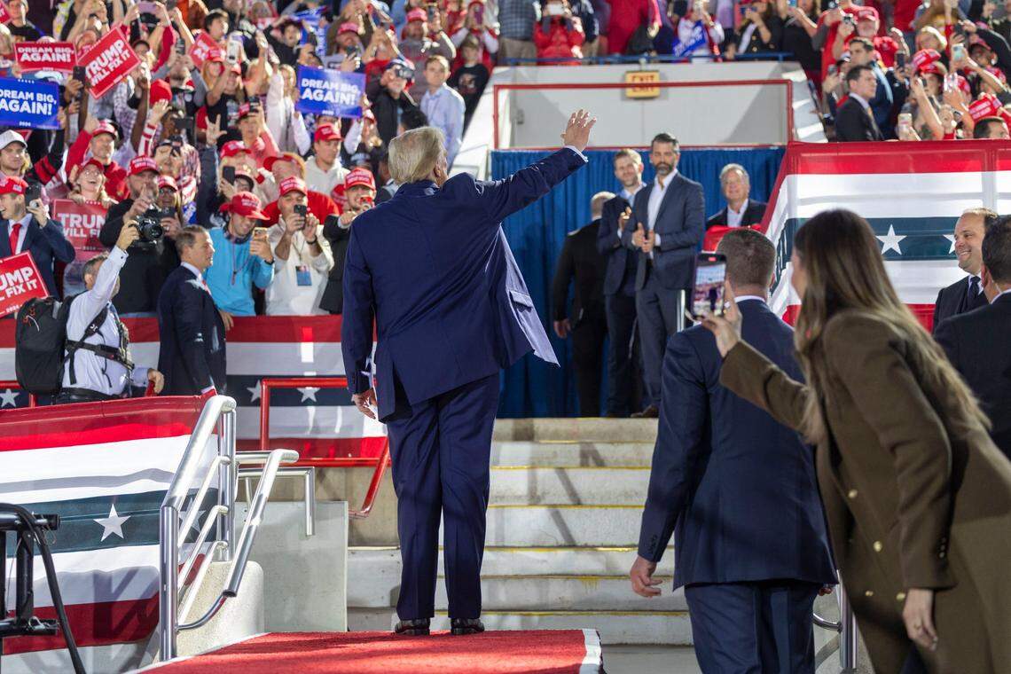 Republican presidential nominee and former President Donald Trump leaves the stage following a rally at Dorton Arena in Raleigh on Monday, Nov. 4, 2024, one day before Election Day.