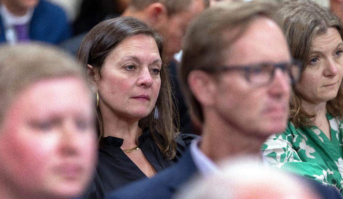 Tara Foreman, left, of Hyde County, who works in the seafood industry, listens to debate debate of an amendment to HB 442 to prohibit shrimp trawling in all inshore fishing waters and within one-half mile of the shoreline during the Senate Agriculture, Energy and Environment committee meeting on Tuesday, June 17, 2025 at the North Carolina General Assembly in Raleigh, N.C. Foreman traveled to Raleigh to speak before the committee, but was not allowed to do so.
