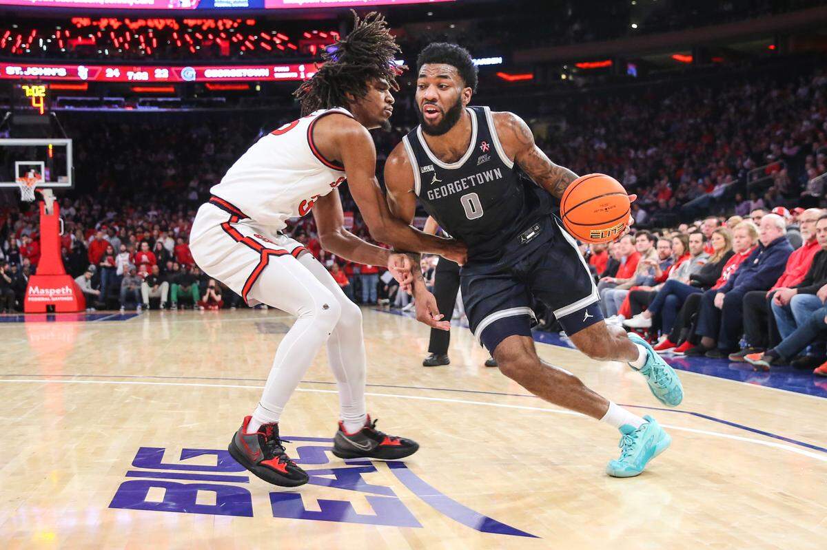 Georgetown Hoyas guard Dontrez Styles (0) looks to drive past St. John’s Red Storm forward Glenn Taylor Jr. (35) in the first half at Madison Square Garden.