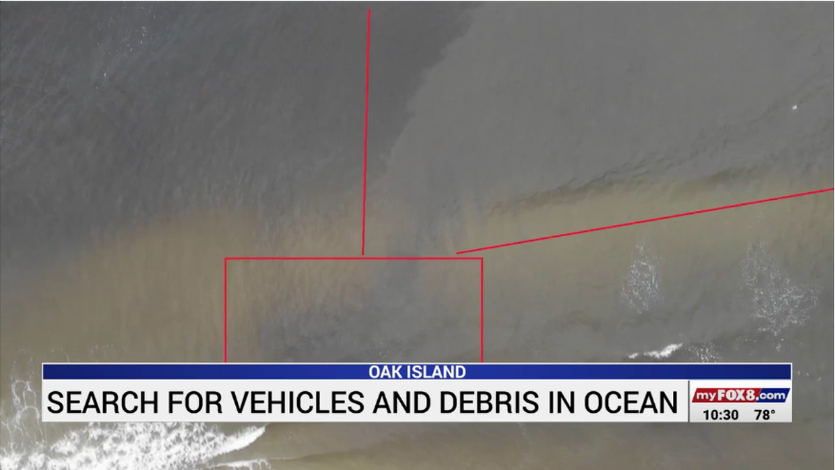 Drone footage from Oak Island Water Rescue shows a large “blob” in the water that officials believe could be one of at least a dozen cars that went missing during Hurricane Isaias on Aug. 3, 2020.