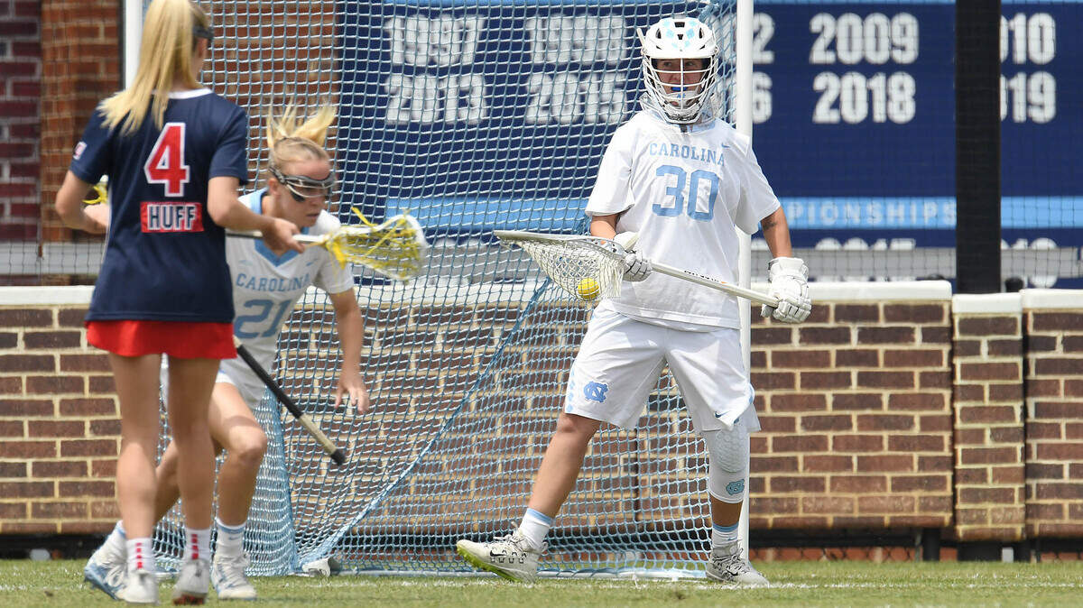 Keeper Taylor Moreno, right, of the University of North Carolina, cradles the ball after making a save against Stony Brook during a game this season.